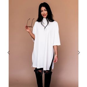 Dressed in LaLa Icon Mock Neck Tee in white. NWT